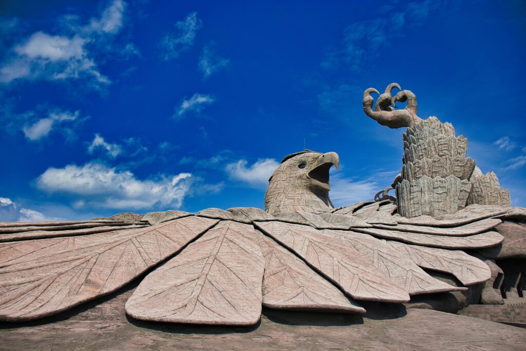 Jatayu Earth's Center: Stunning Eagle Sculpture Against a Vibrant Sky in Chadayamangalam.