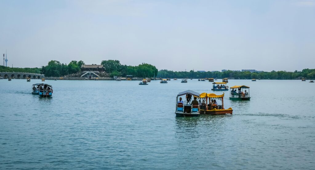 Tourists enjoy a scenic boat ride on Kunming Lake at the Summer Palace in Beijing.